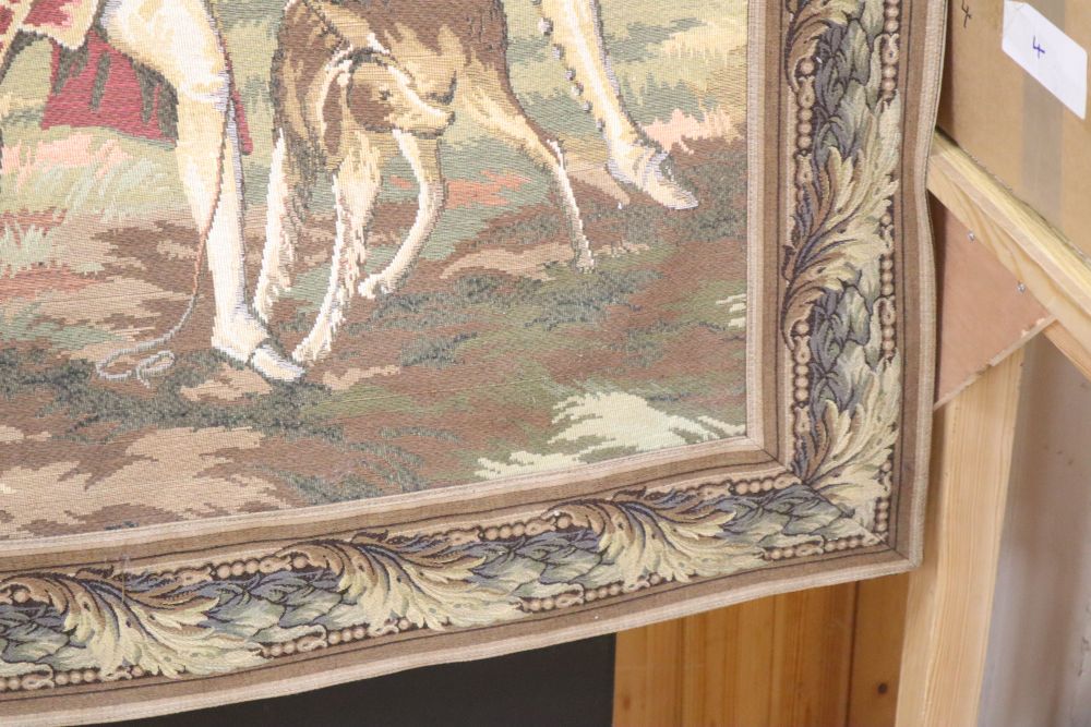 An Aubusson style machine woven hanging tapestry depicting a hunting party, with pole